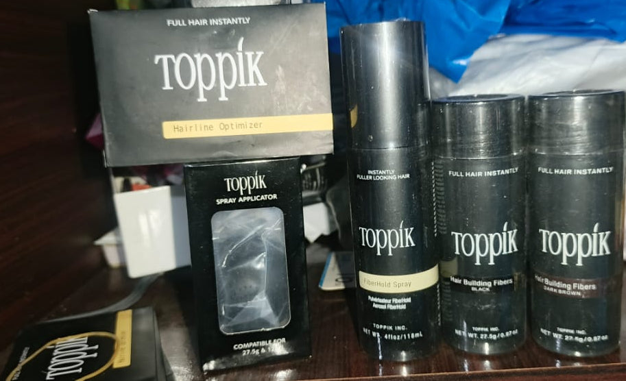 Toppik Hair Building Fiber 4-in-1 Combo Pack. This set includes Toppik Hair Fiber, Fiber Hold Spray, a Spray Applicator Pump, and a Hairline Optimizer Comb