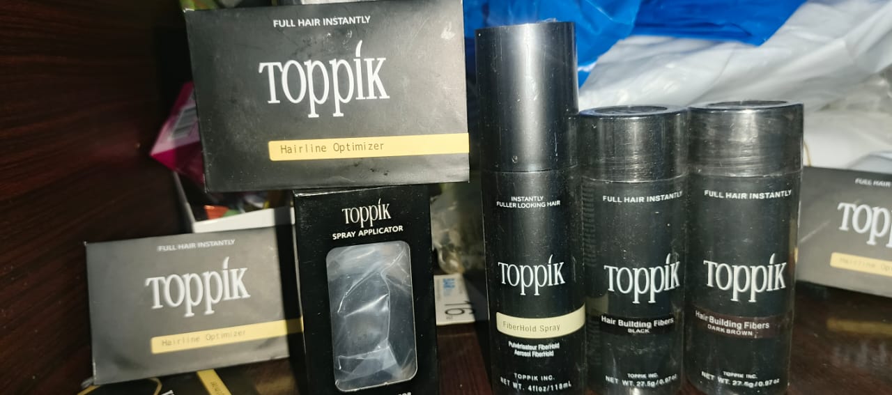 Toppik Hair Building Fiber 4-in-1 Combo Pack. This set includes Toppik Hair Fiber, Fiber Hold Spray, a Spray Applicator Pump, and a Hairline Optimizer Comb